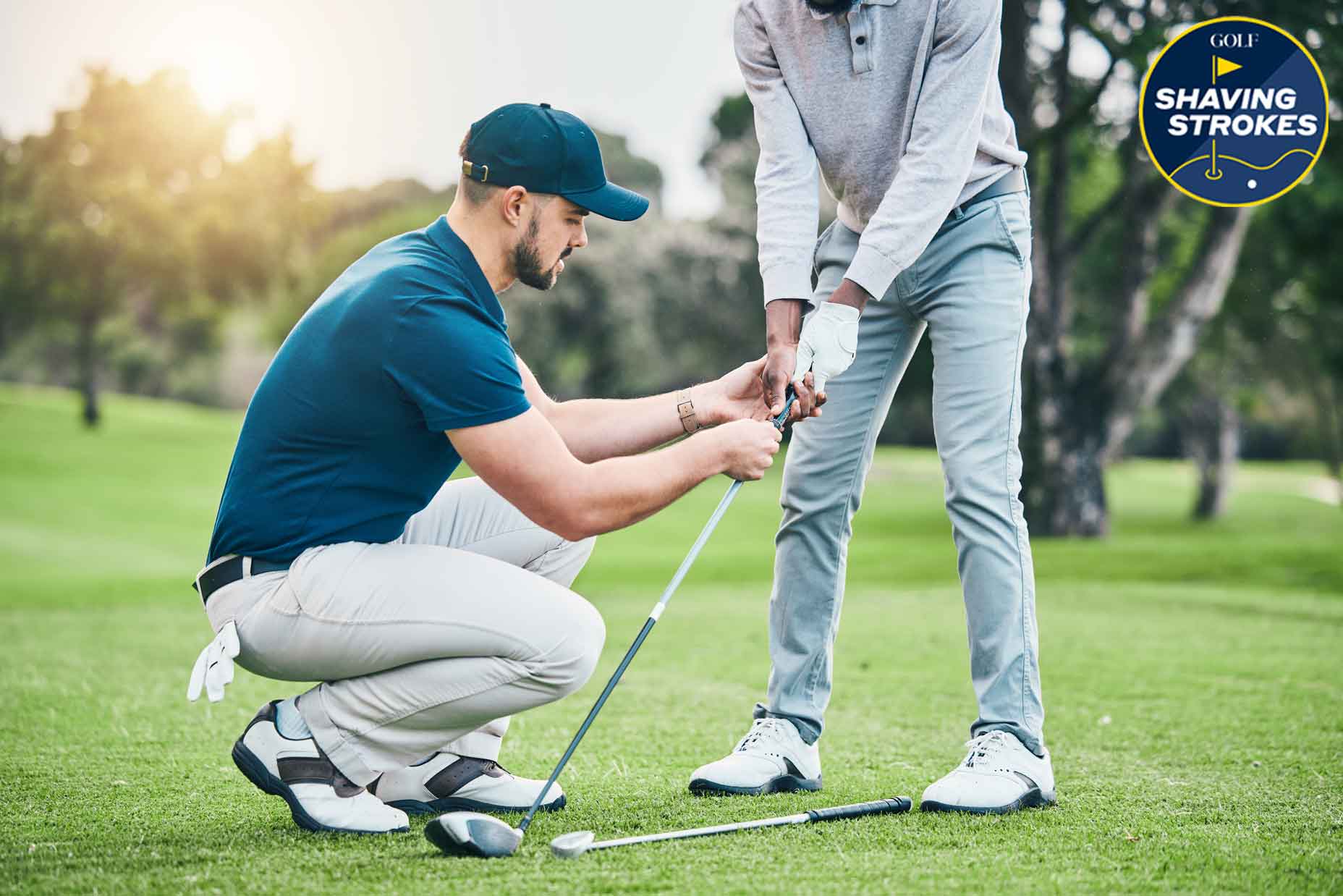 golf coach helps student with their grip