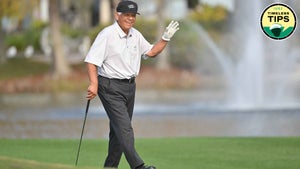 lee trevino waves to crowd during 2022 PNC championship