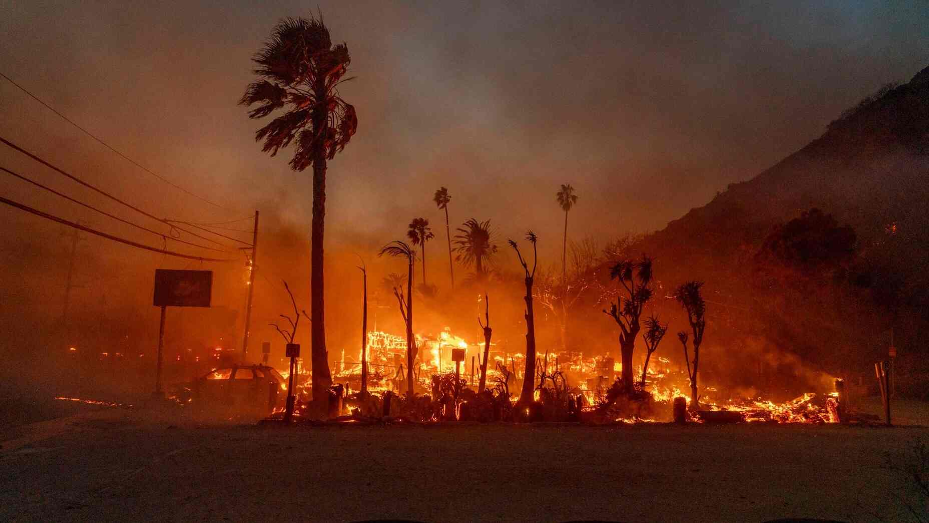 A structure burns during the Palisades fire in the Pacific Palisades neighborhood of Los Angeles.