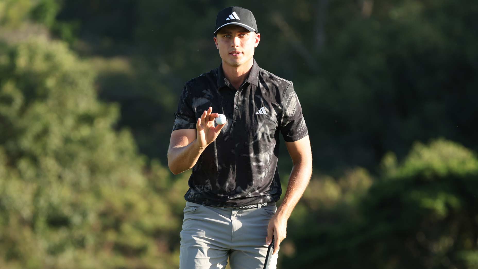 PGA Tour pro Ludvig Aberg, a betting favorite at the 2025 Farmers Insurance Open, reacts on the 18th green during the second round of The Sentry 2025 at Plantation Course.