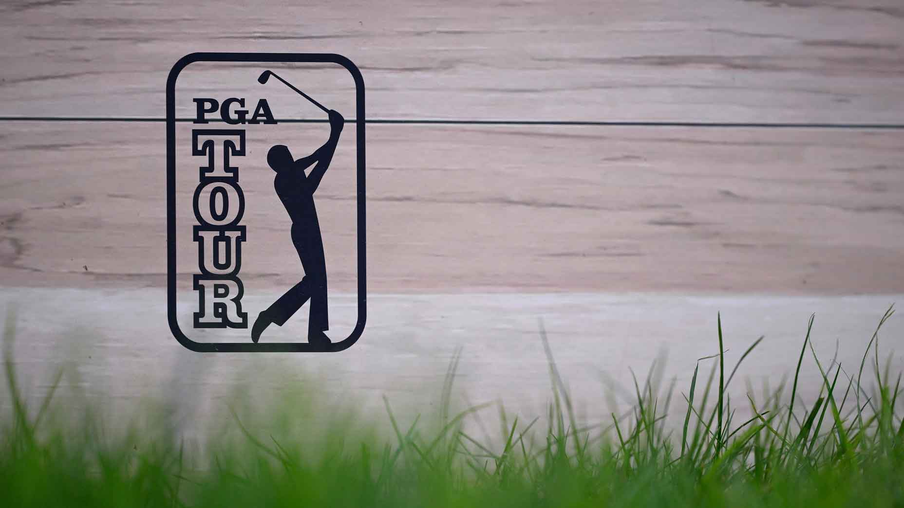 pga tour logo on wooden wall