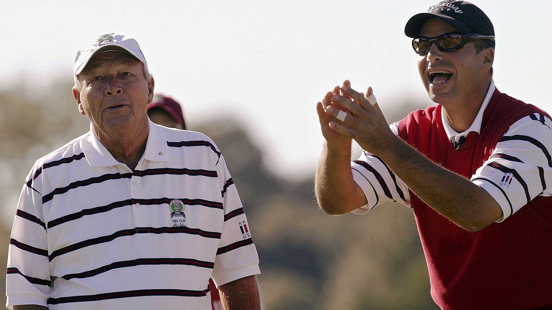 Rocco Mediate and Arnold Palmer on the golf course.