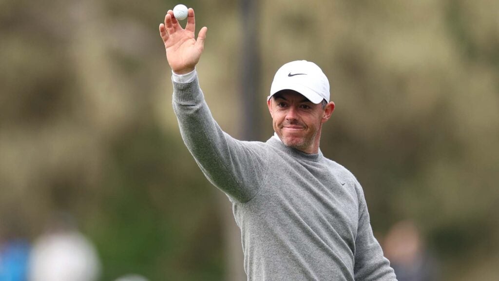 Rory McIlroy celebrates after making an ace during the first round of the Pebble Beach Pro-Am.