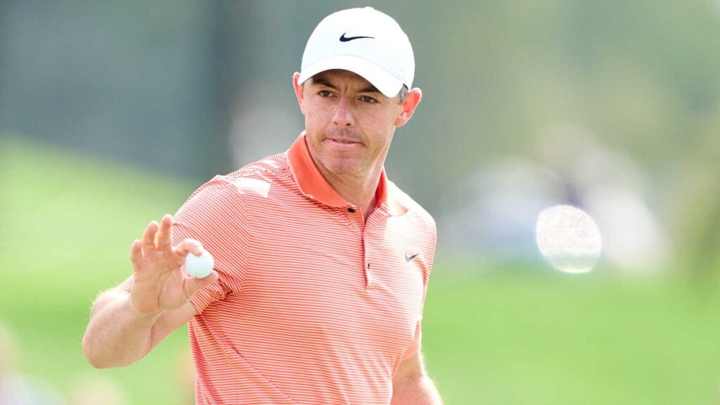 Pro golfer Rory McIlroy reacts on the 1st hole during the final round of the the Hero Dubai Desert Classic at Emirates Golf Club.