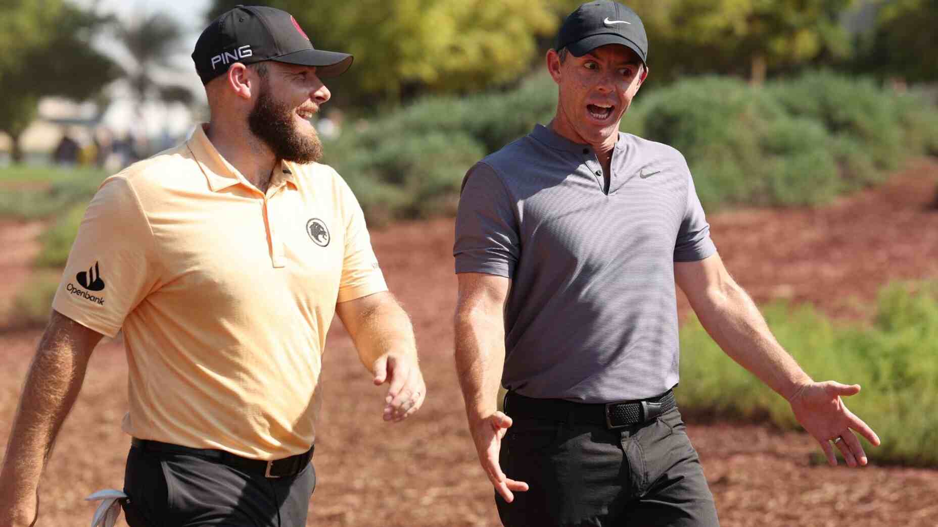 Rory McIlroy talks to Tyrrell Hatton during the first round of the DP World Tour Championship.