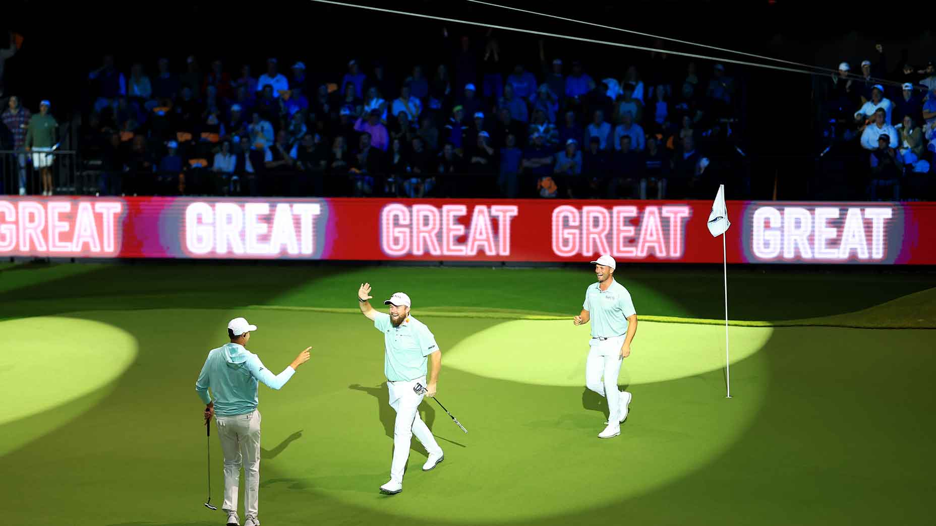 Members of the Bay Golf Club wave to the crowd at the Sofi Center for the first ever TGL game.