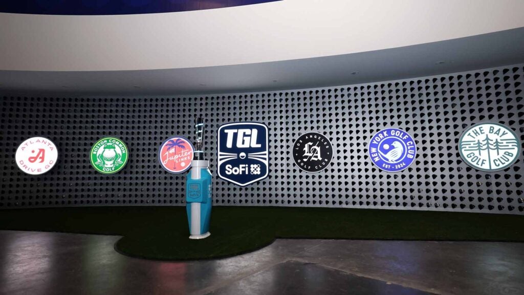 how to watch TGL: TGL team logos behind the winners trophy before the TGL presented by SoFi match between the New York Golf Club and The Bay Golf Club at SoFi Center on January 07, 2025.