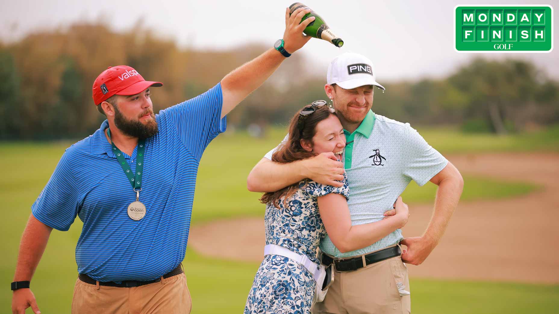 Brian Campbell of the United States and his girlfriend Kelsi McKee get Champagne poured on them by his caddie Cooper Wilson on the 18th hole.