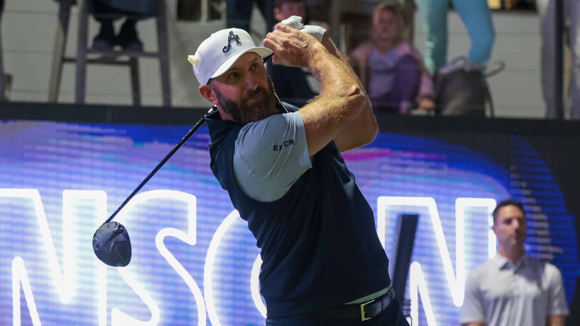 Dustin Johnson hits a shot at LIV Golf Riyadh.