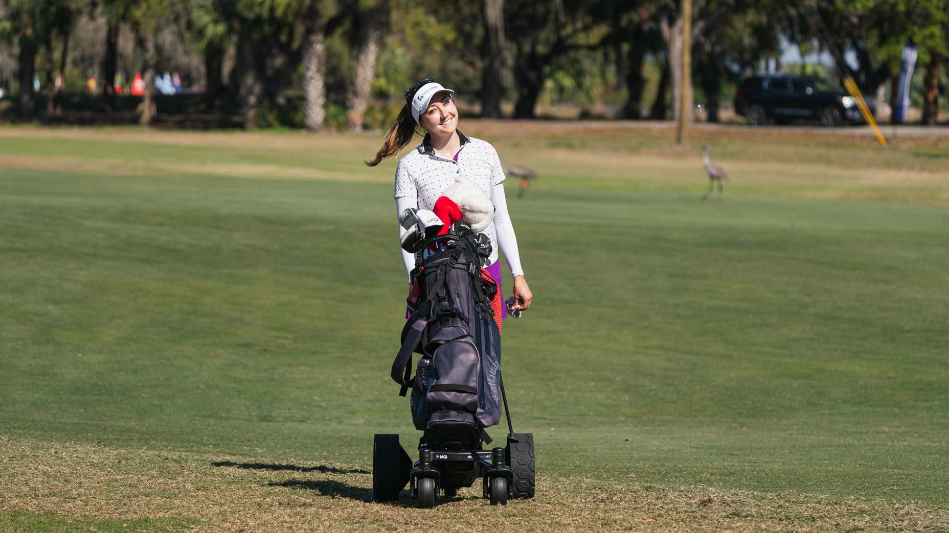 Epson Tour player Jillian Hollis uses an electric caddie at the Central Florida Championship.