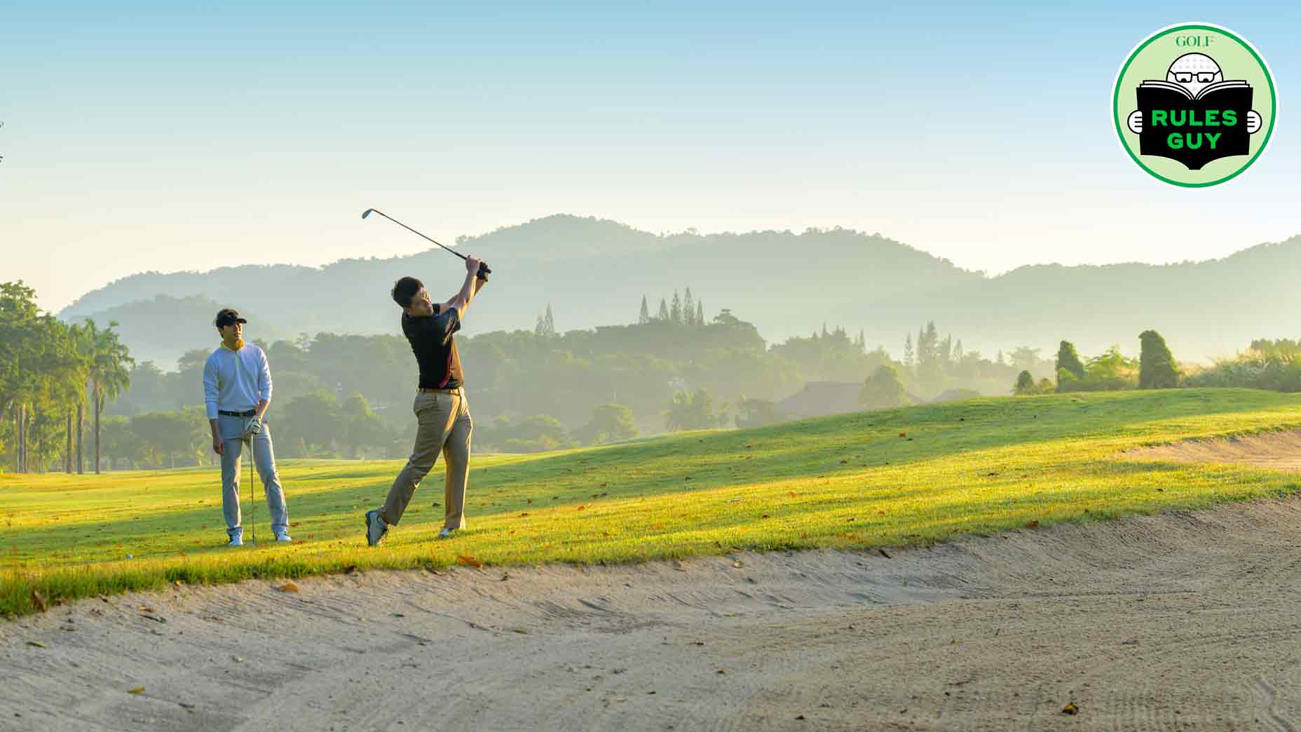 Two male golfers going through a round of golf