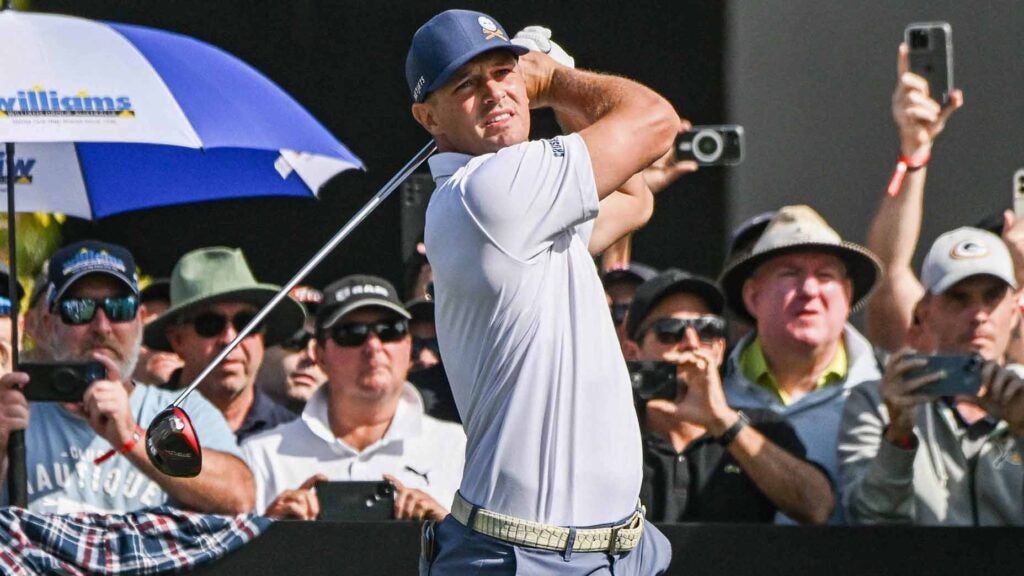 Bryson DeChambeau hits drive at LIV Golf Adelaide event in 2023.