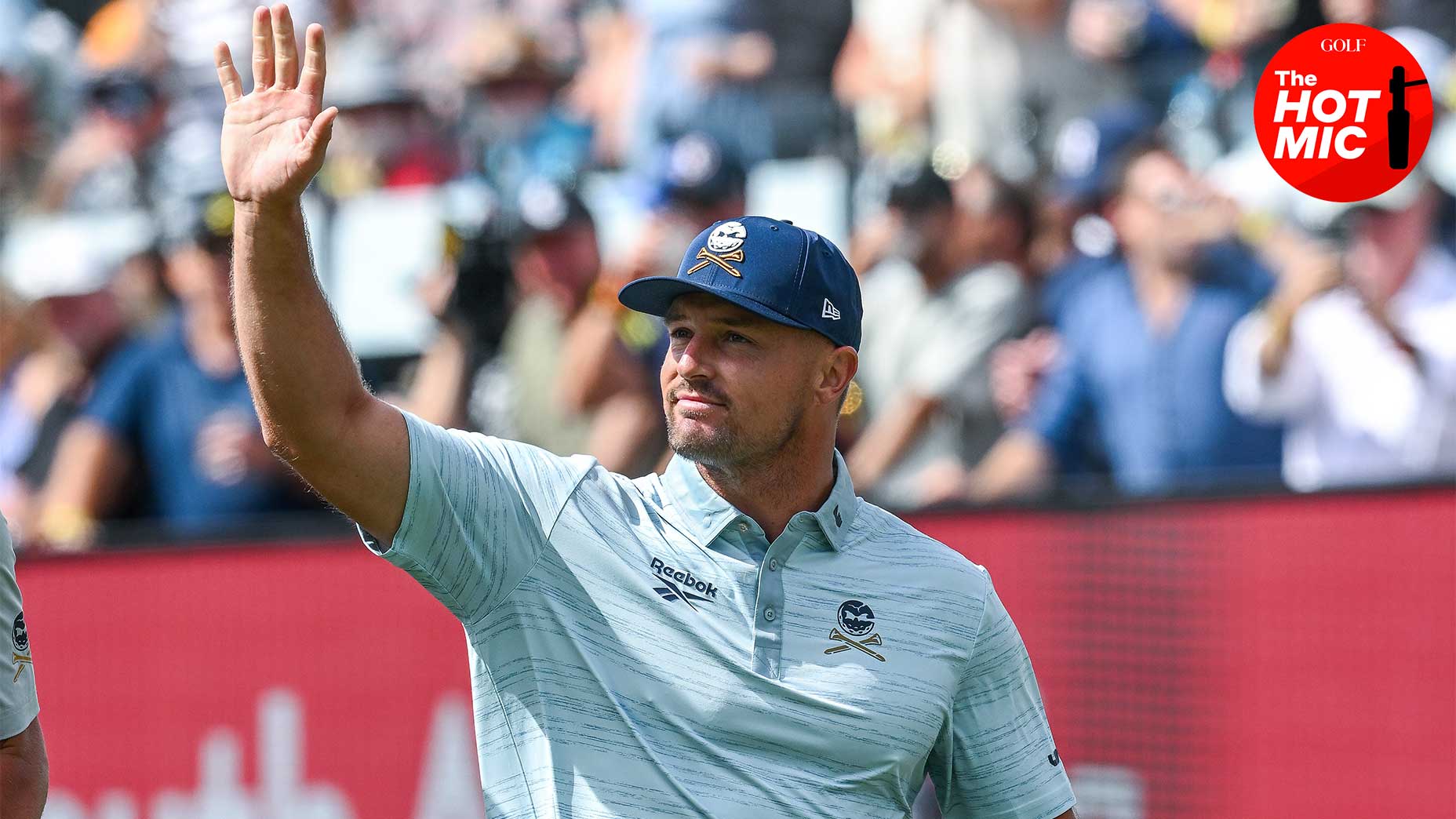 Bryson DeChambeau Waves Putter Wearing Blue Shirt at Liv Adelaide