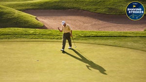 golfer in yellow shirts celebrates on green