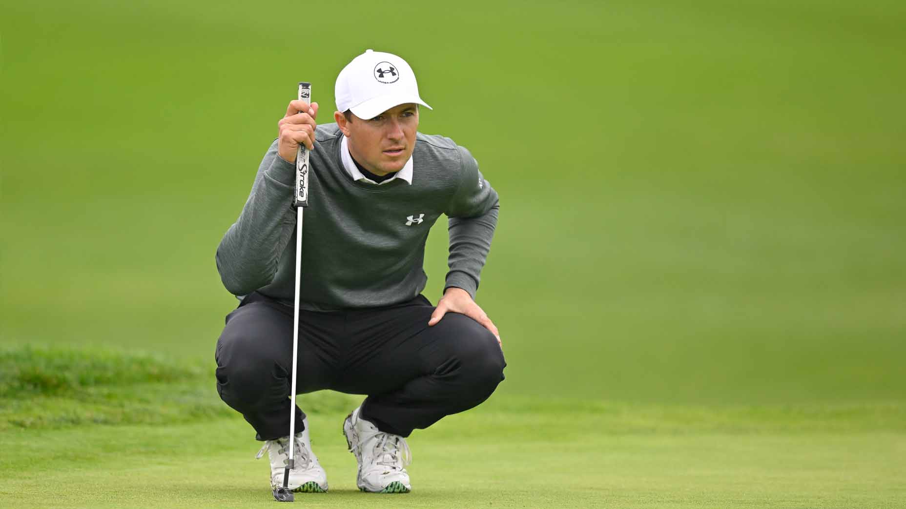 Jordan Spieth reads a green during the 2025 Genesis Invitational.