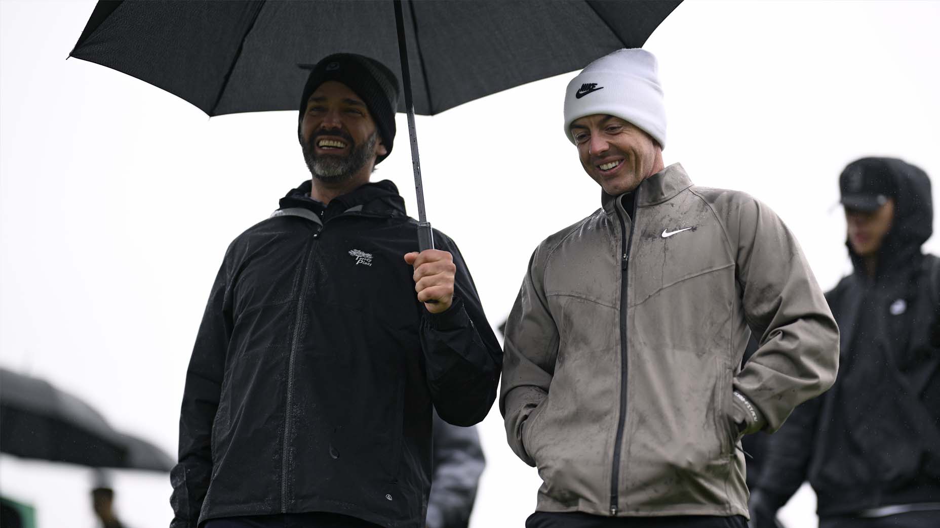 PGA Tour Pro Rory McIlroy talks with Donald Trump Jr. during the 2025 Genesis Invitational Tournament.