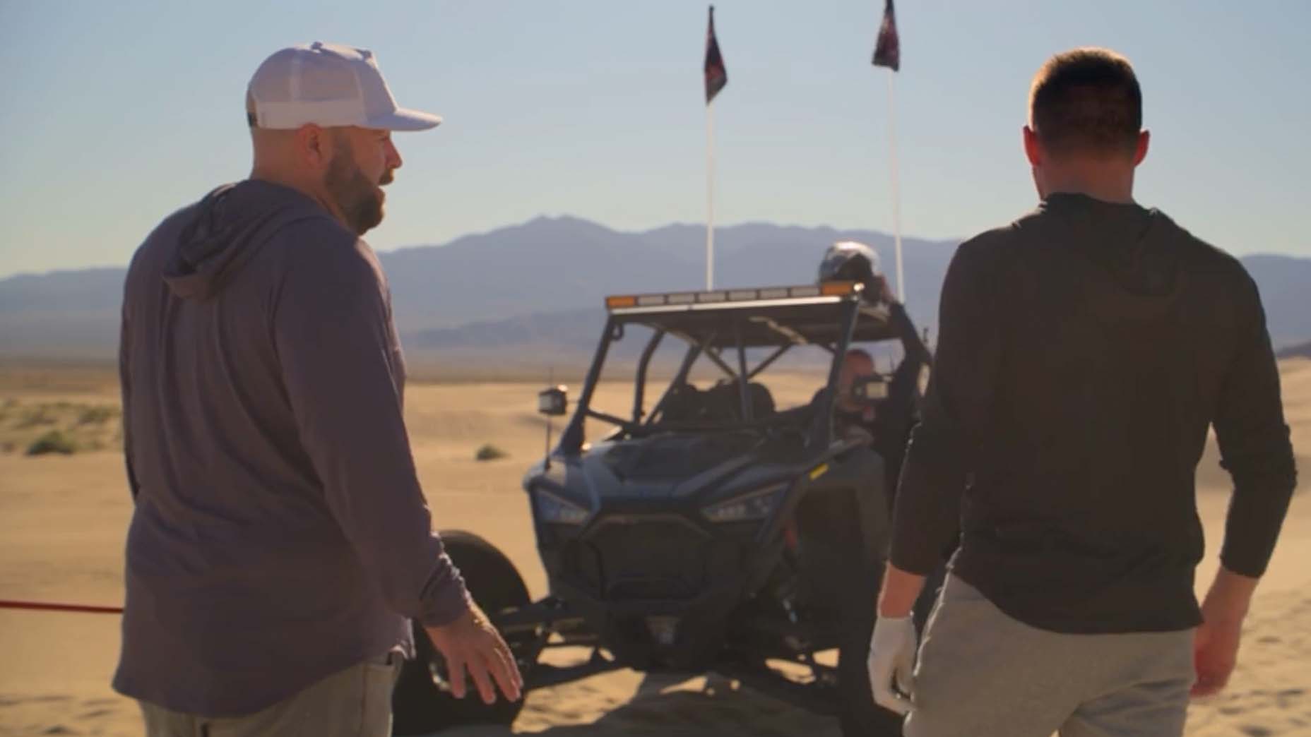 Subpar's Colt Knost and Drew Stoltz prepare to ride the sandrails with NASCAR's Kyle Busch.