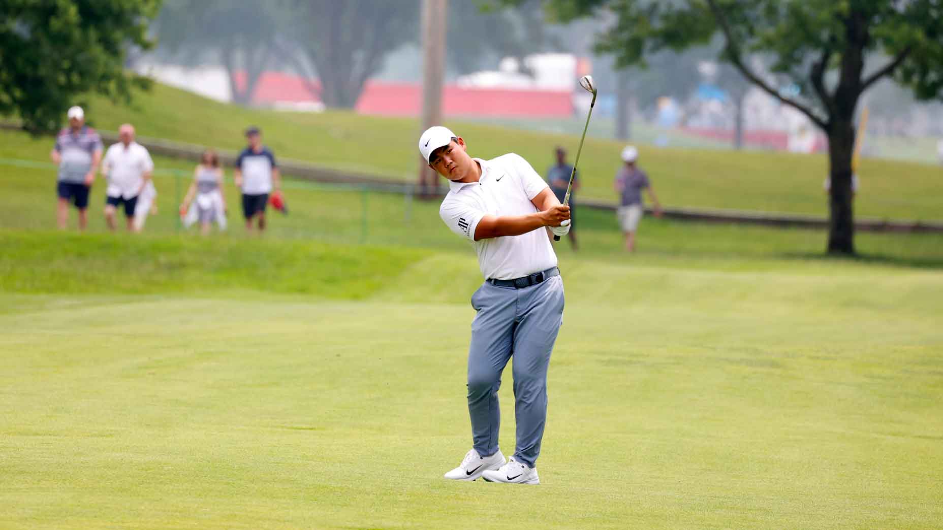 tom kim hits a wedge during the 2023 rocket mortgage classic