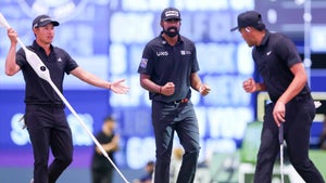 Tony Finau, Collin Morikawa and Sahith Theegala react to a putt during their TGL match against New York Golf Club.