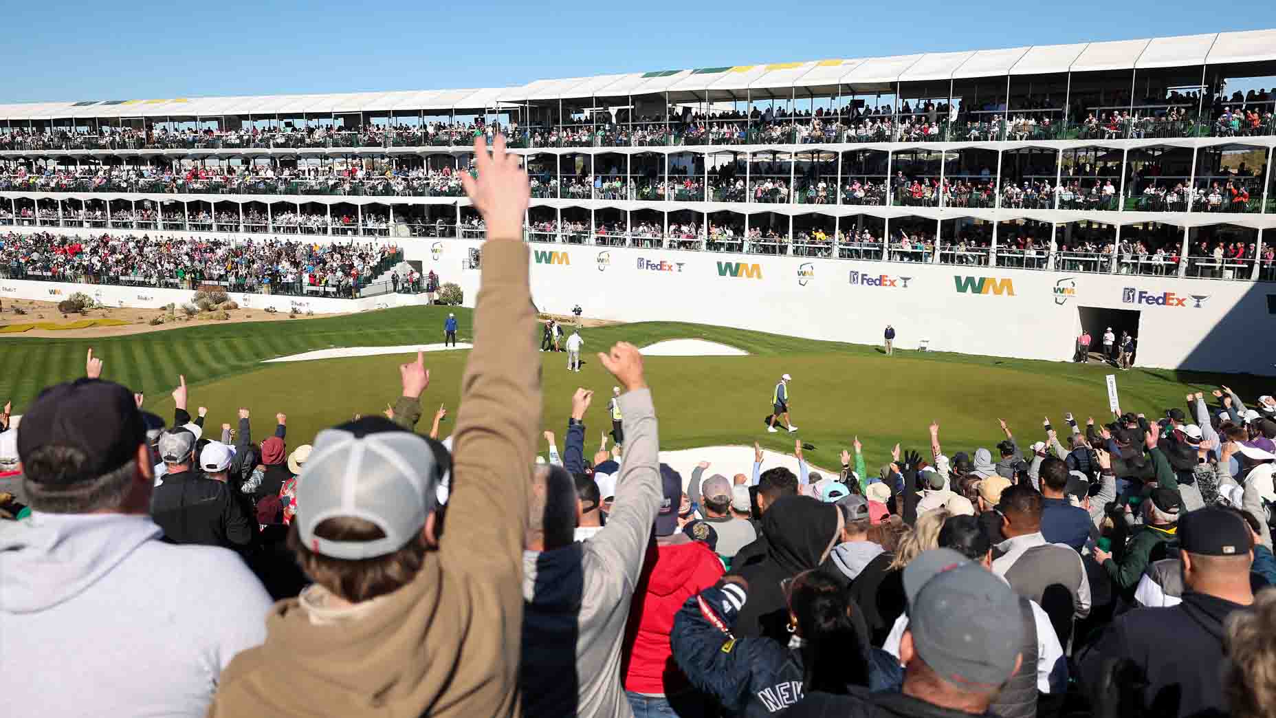 Fans celebrate at the 16th hole during the WM Phoenix Open.