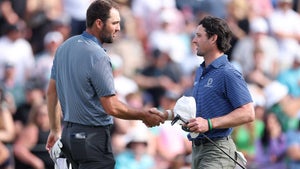 Scottie Scheffler and Will Chandler shake hands at the WM Phoenix Open.