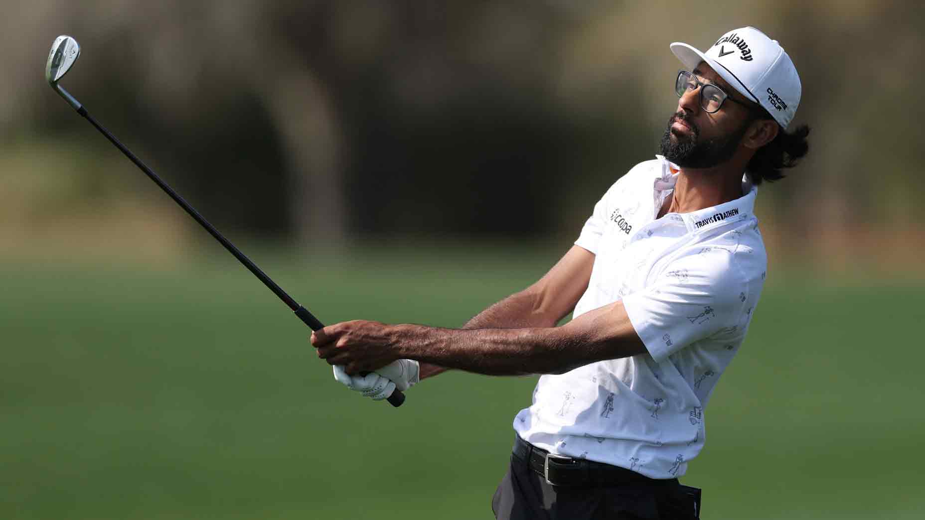 Akshay Bhatia hits a wedge at Players Championship