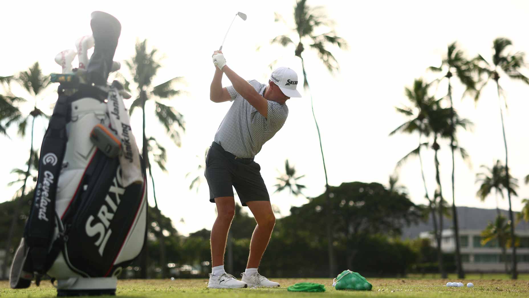 Max McGreevy hits balls on the range at the Sony Open.