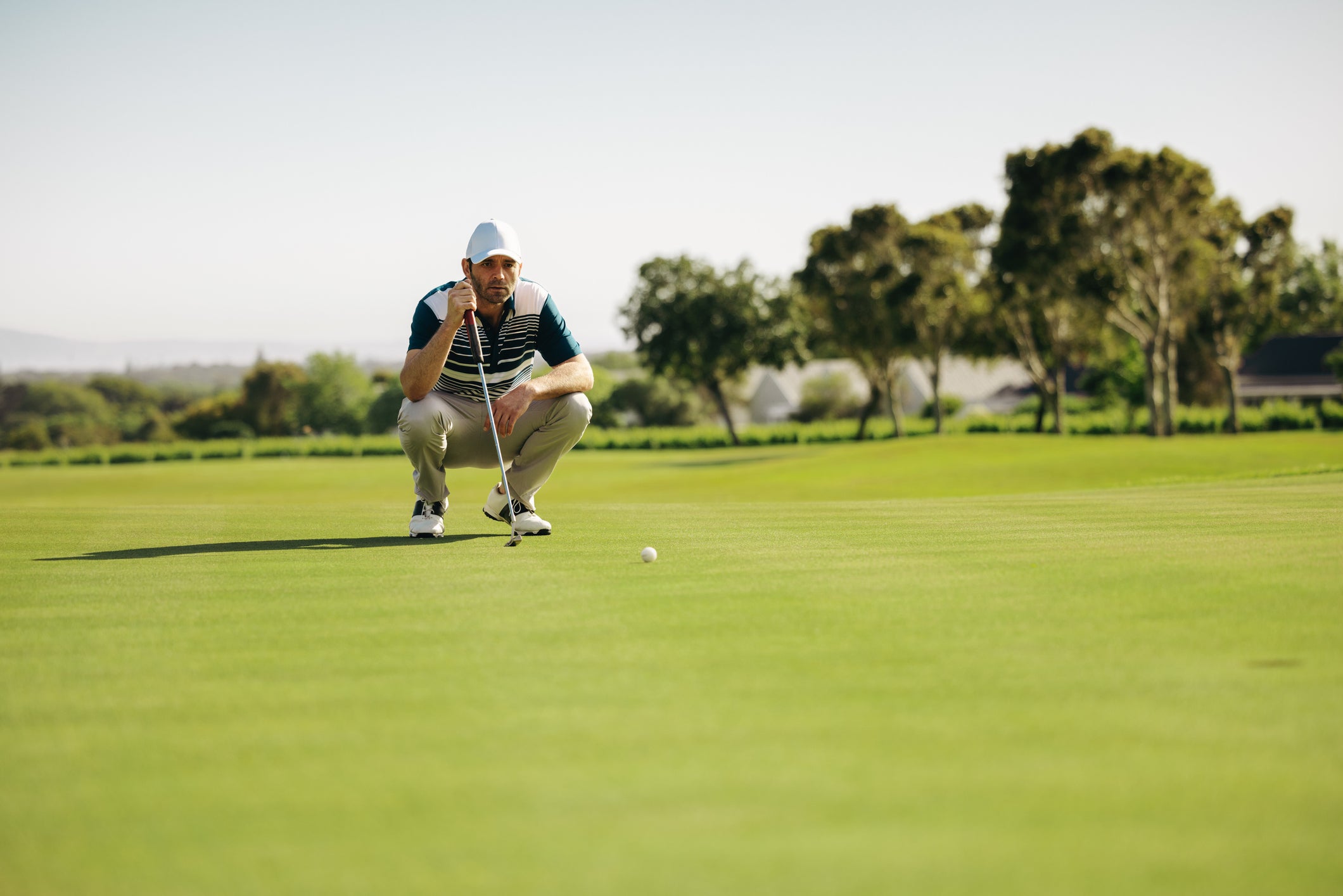 Golf playing a stroke