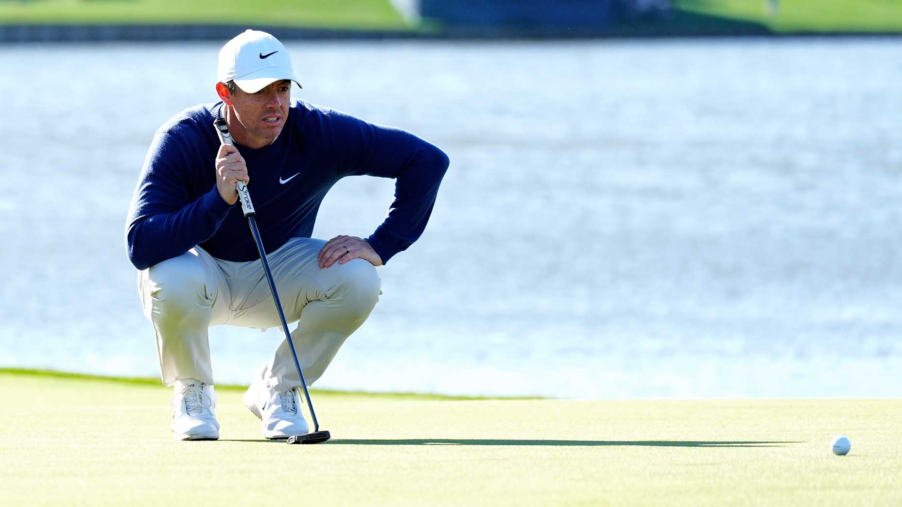 Rory McIlroy lines up a putt at TPC Sawgrass.