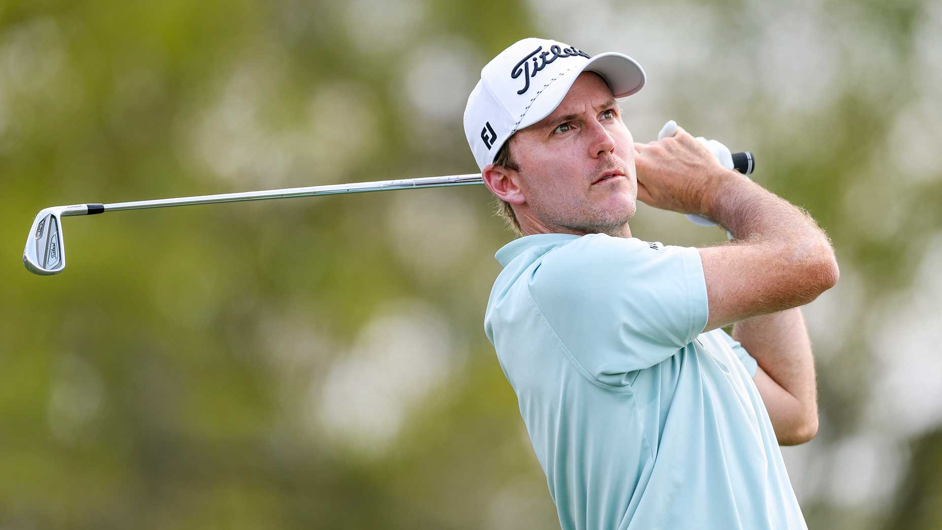 Russell Henley hits an iron shot at the Arnold Palmer Invitational.