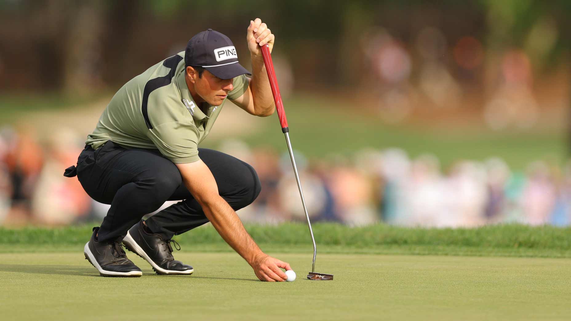 Viktor Hovland lines up a putt at the Valspar.