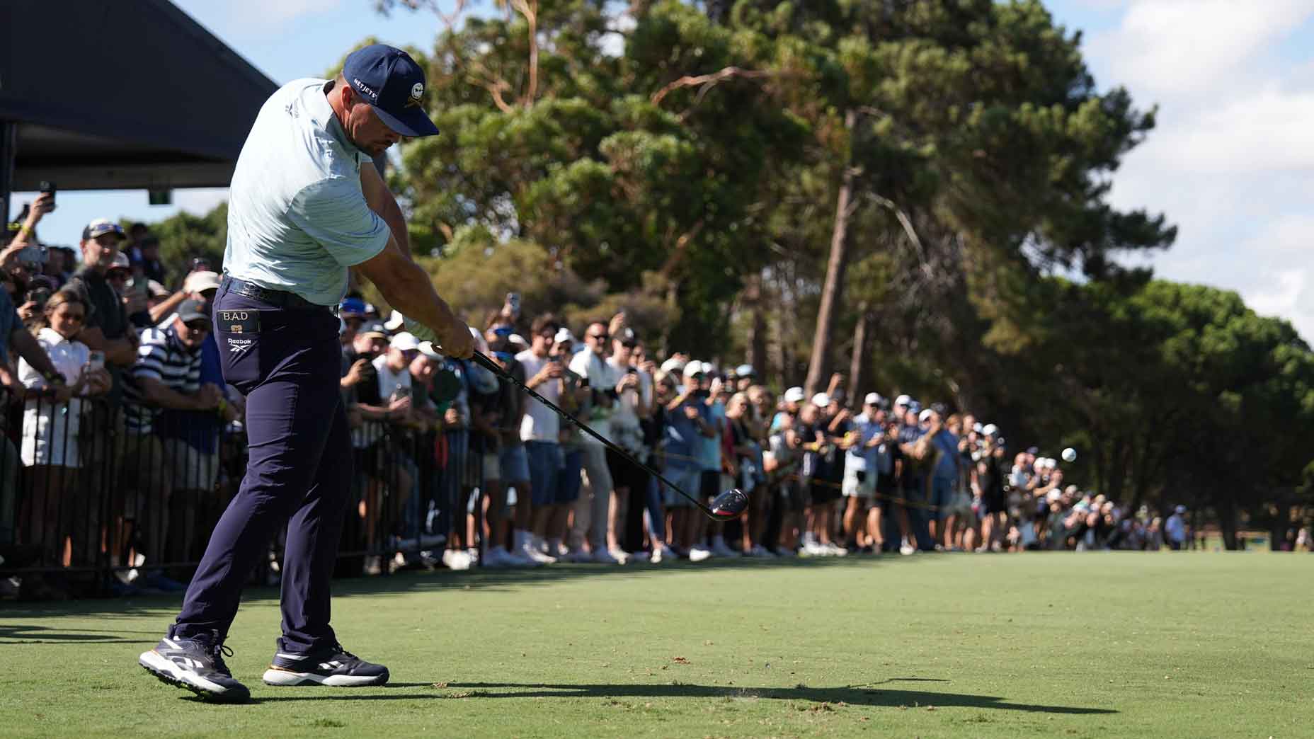 bryson dechambeau hits a drive during LIV Singapore