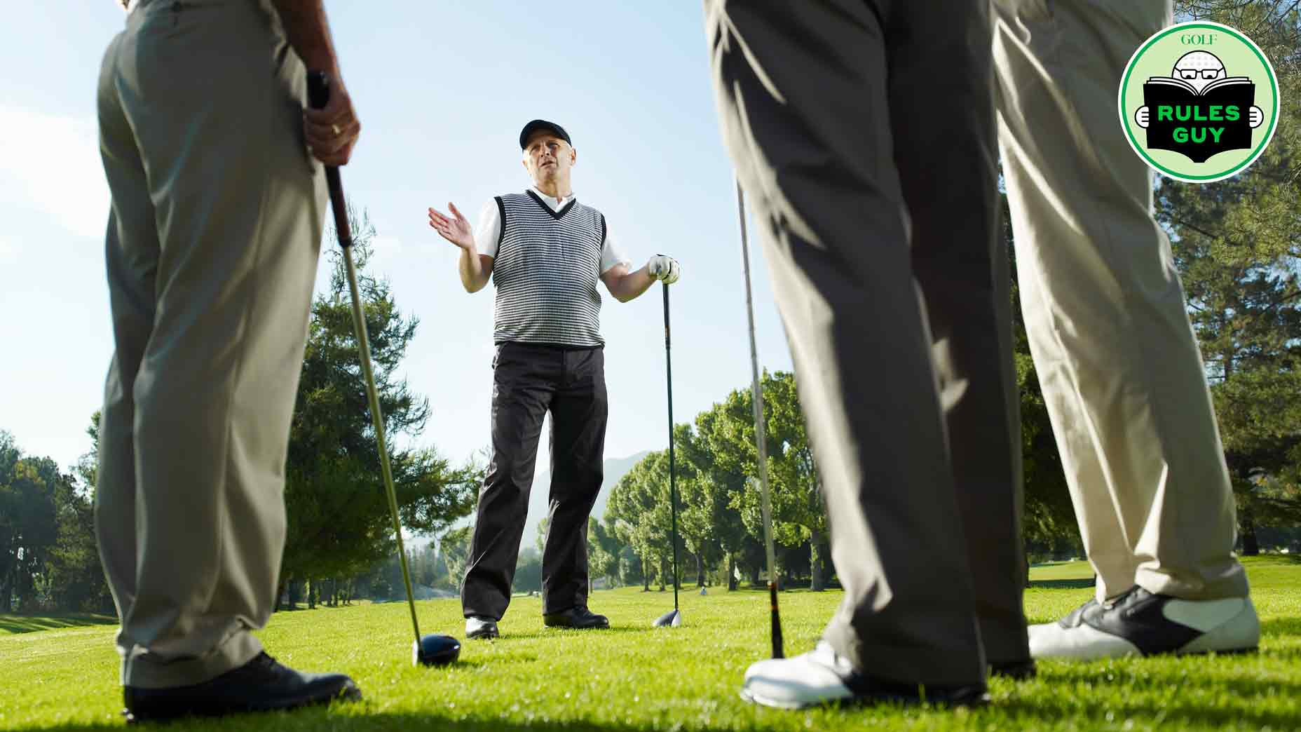 Golfers talking in a circle on course