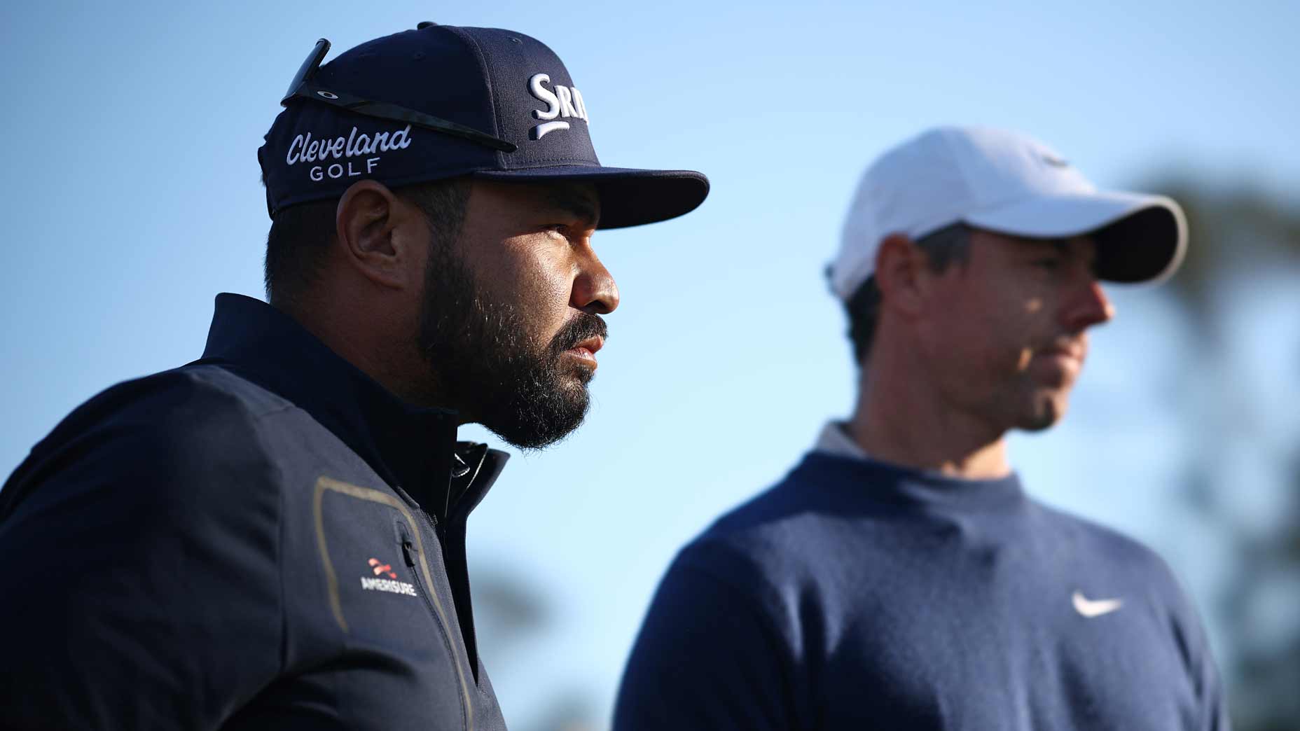 PGA Tour pro J.J. Spaun, who lost a lot of Playes Championship money on Monday, and Rory McIlroy during the playoff at TPC Sawgrass.