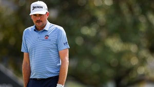 keegan bradley in a blue shirt and white hat with black pants at the Arnold Palmer Invitational.