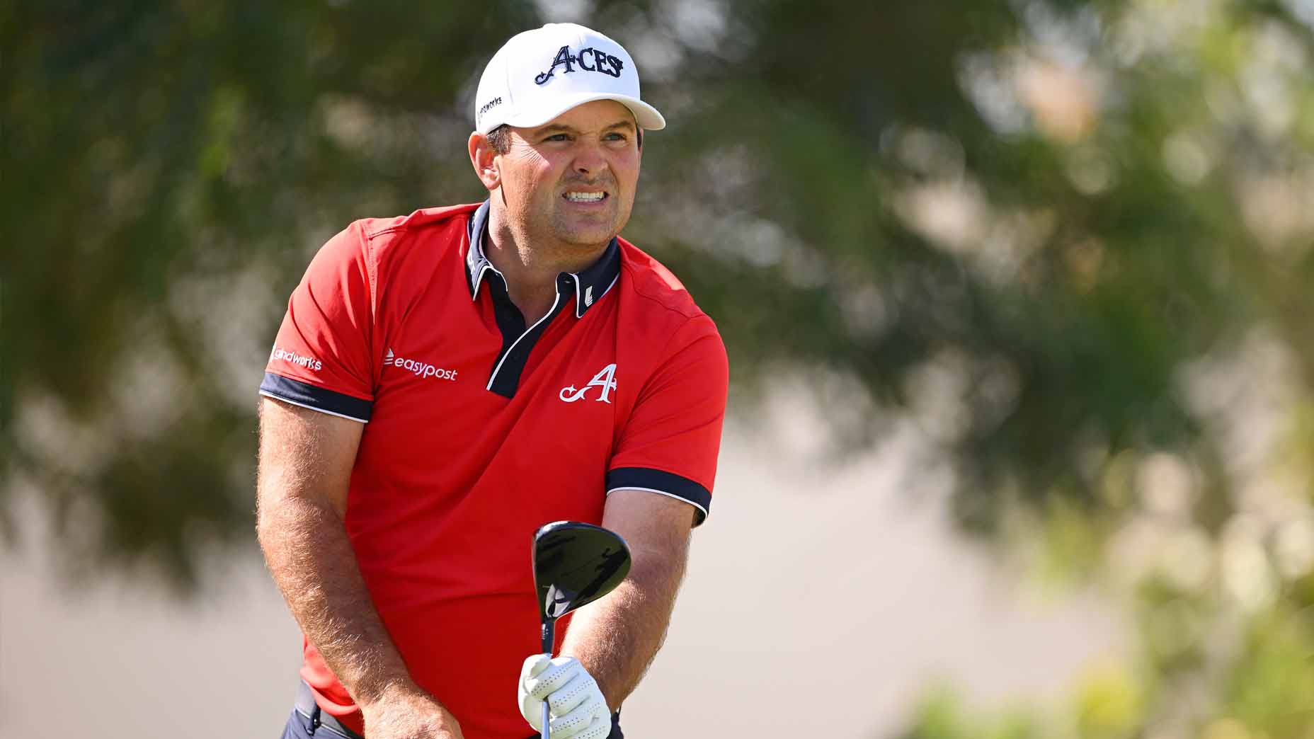 Patrick Reed reacts to a tee shot at the 2025 Ras Al Khaimah Championship.