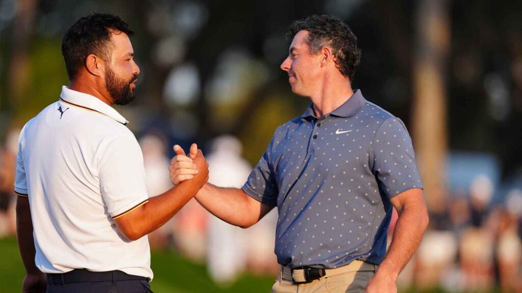 Rory McIlroy and J.J. Spaun shake hands after the third round of the 2025 Players Championship at TPC Sawgrass.