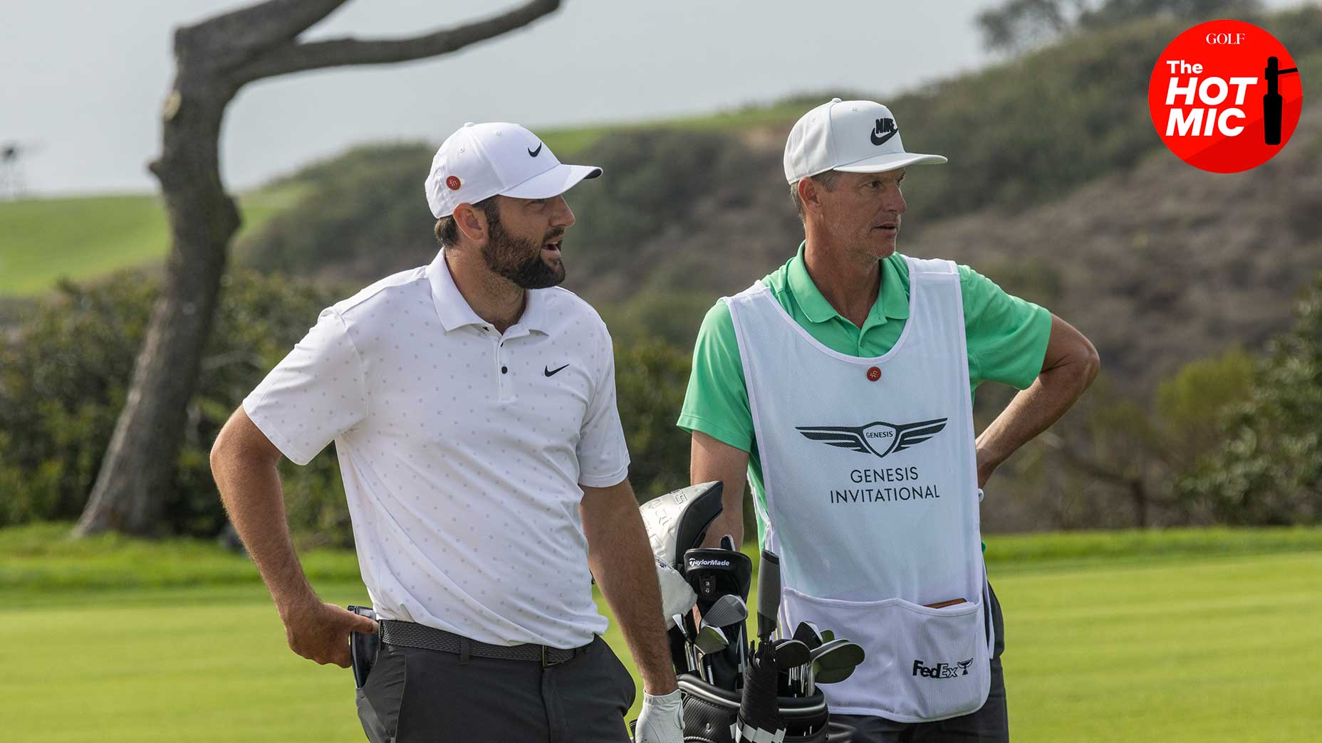 scottie scheffler and ted scott speak to one another at Torrey Pines Golf Course in white shirt, hat and white bib.