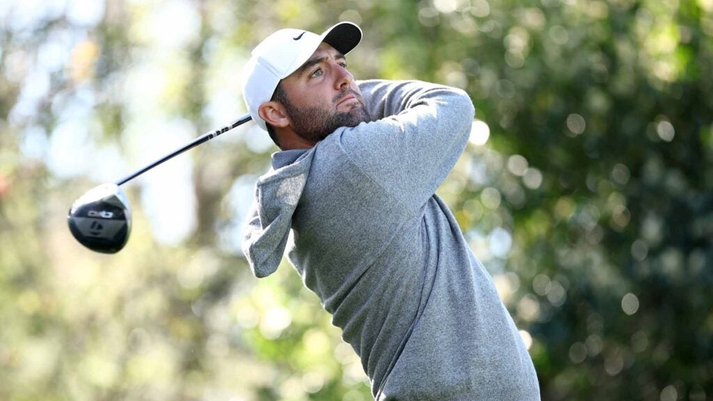 PGA Tour pro Scottie Scheffler plays his shot from the 15th tee prior to the 2025 Players Championship on the Stadium Course at TPC Sawgrass.