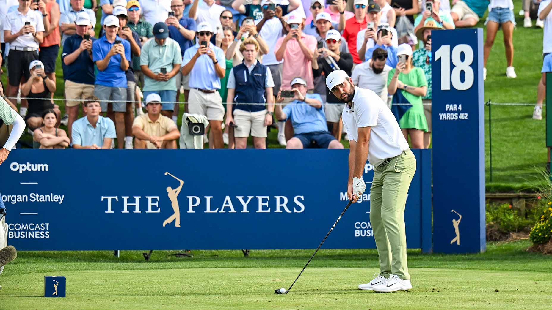 Scottie Scheffler tees off on the 18th hole during the final round of the 2024 Players Championship.