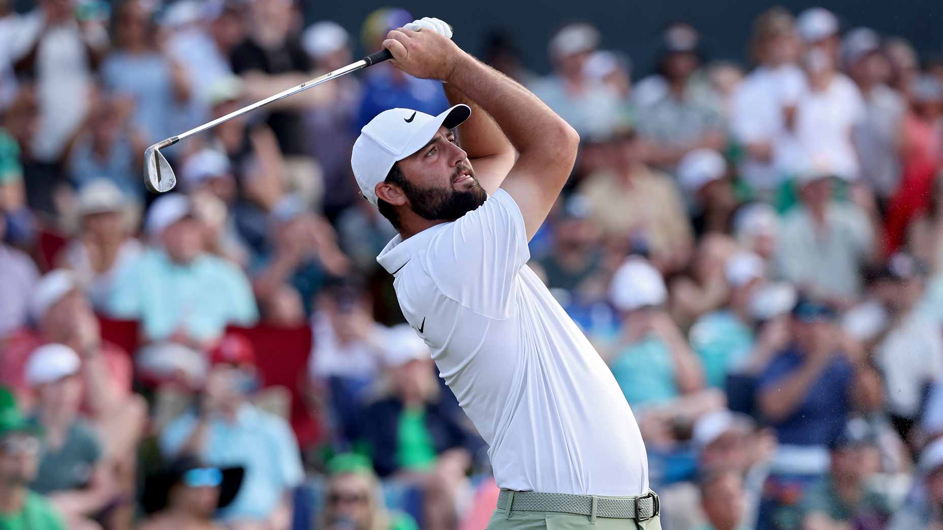 PGA Tour pro Scottie Scheffler, favorite in betting odds, plays his shot from the 17th tee during the final round of the 2024 Players Championship at TPC Sawgrass.