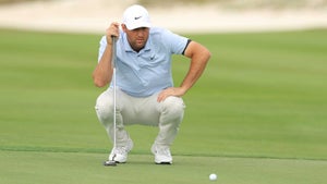 Scottie Scheffler lines up a putt during the 2024 Hero World Challenge.