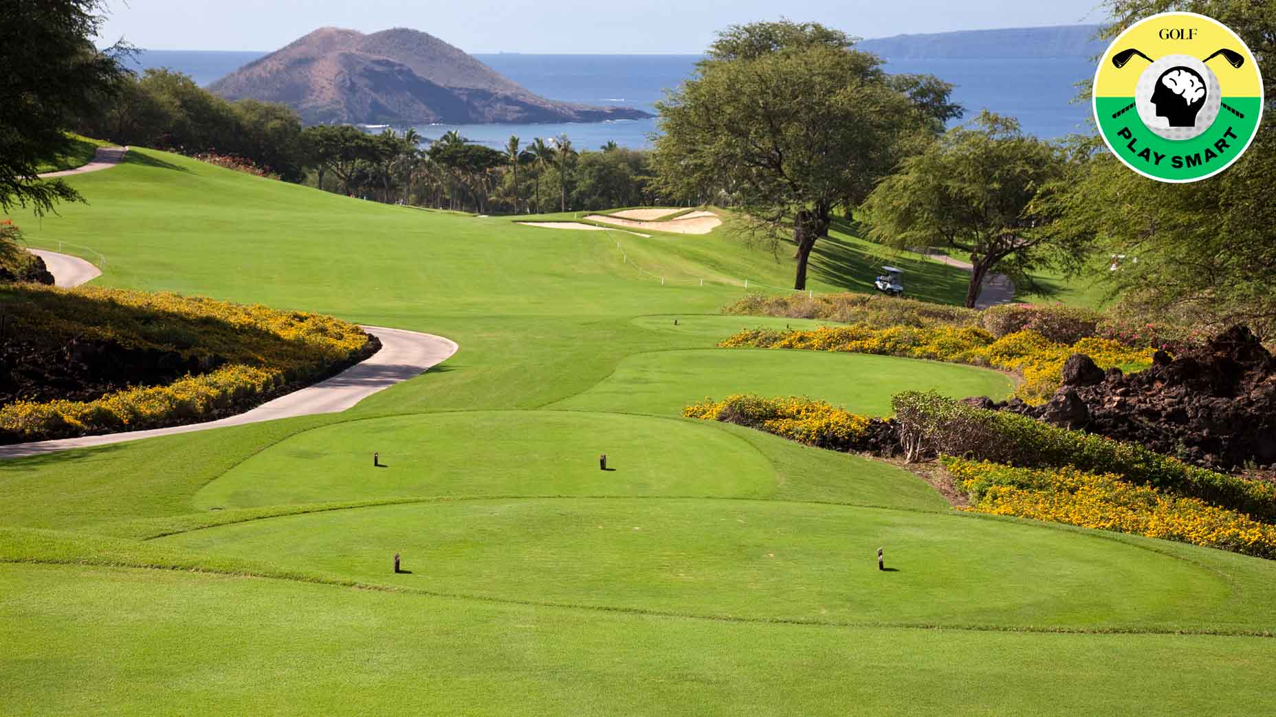 tee boxes on golf course with ocean in background