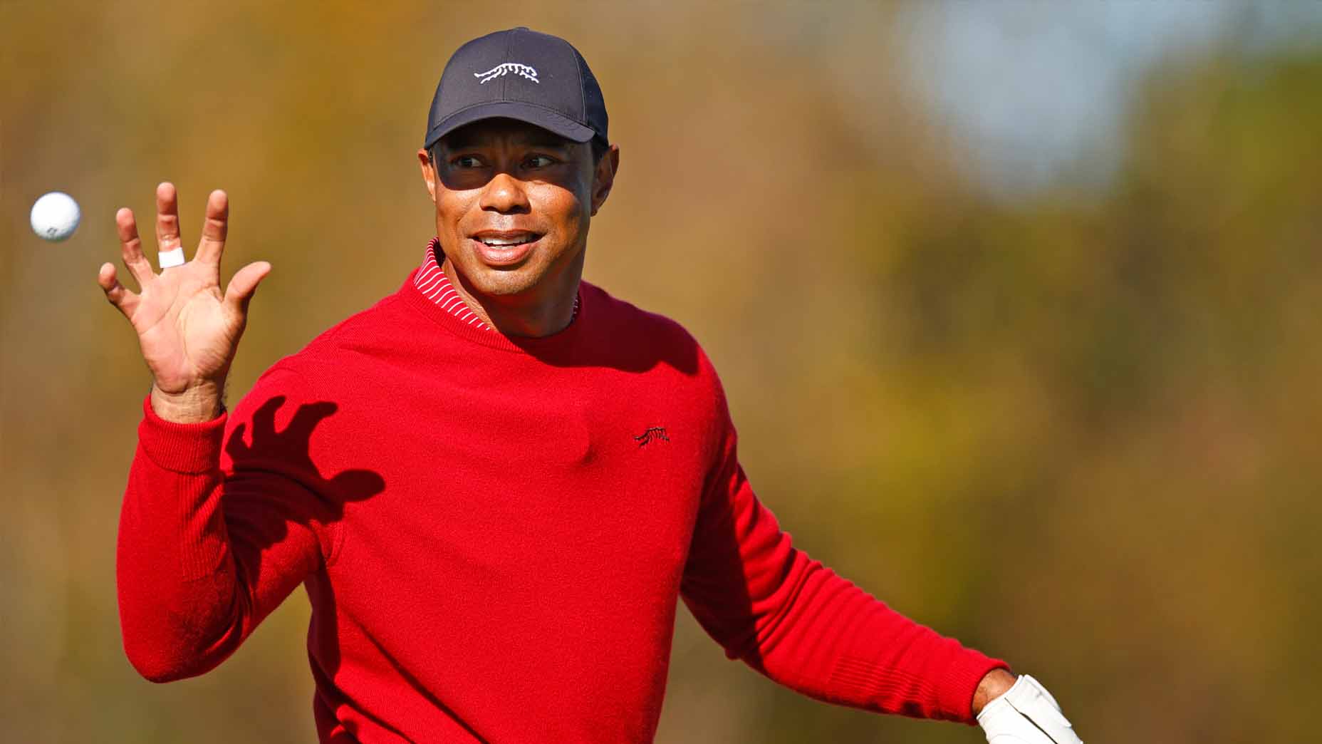 Tiger Woods warms up on the driving range ahead of the PNC Championship.