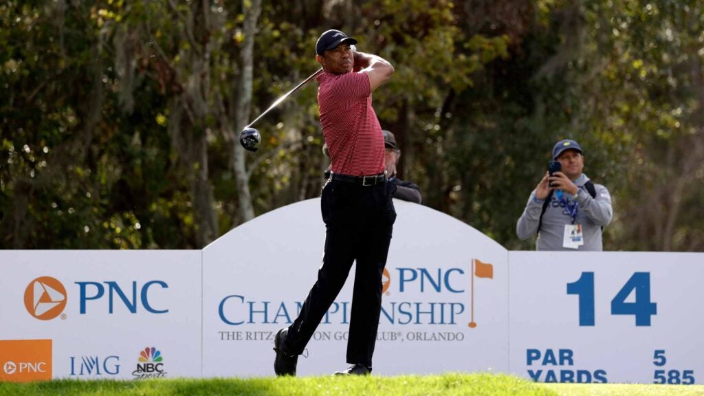 Tiger Woods plays his shot from the 14th tee during the second round of the PNC Championship at Ritz-Carlton Golf Club.