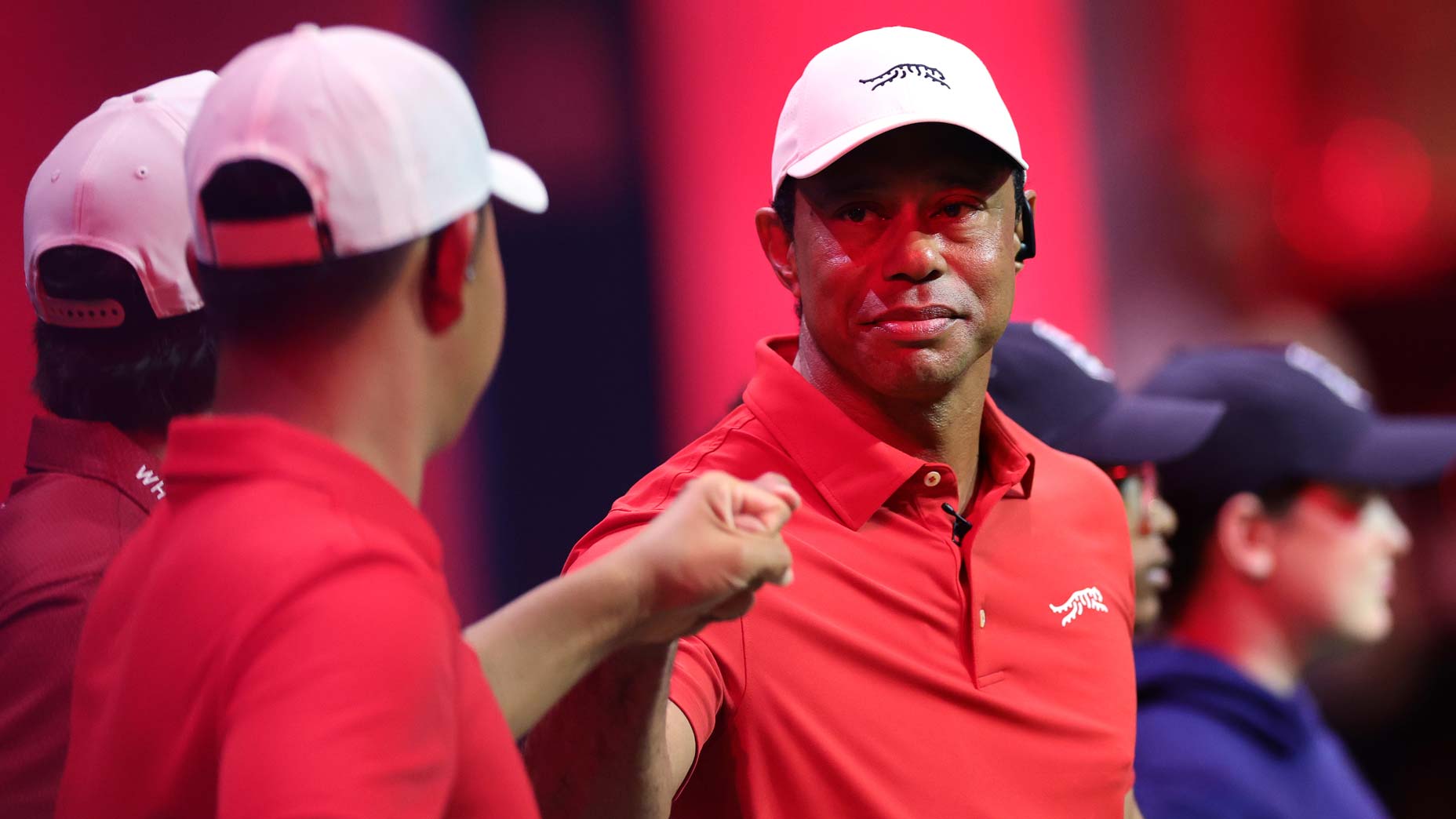 TGL pro Tiger Woods of Jupiter Links Golf Club bumps fists with Tom Kim before their TGL presented by SoFi match against the Boston Common Golf at SoFi Center.