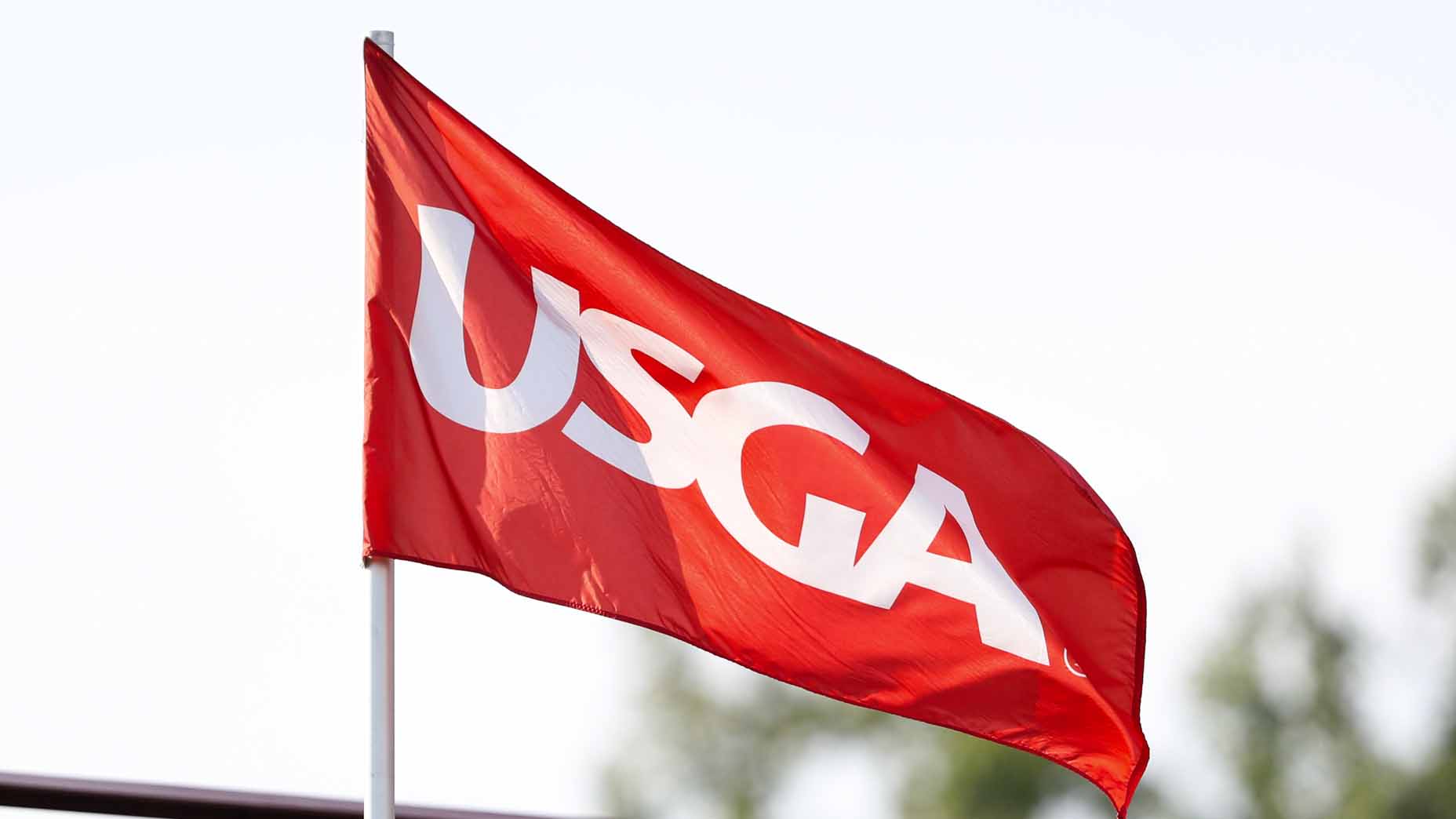 A USGA flag blows during U.S. Junior Amateur Championship.