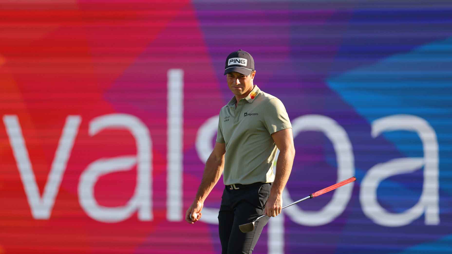 viktor hovland stands in front of valspar signage