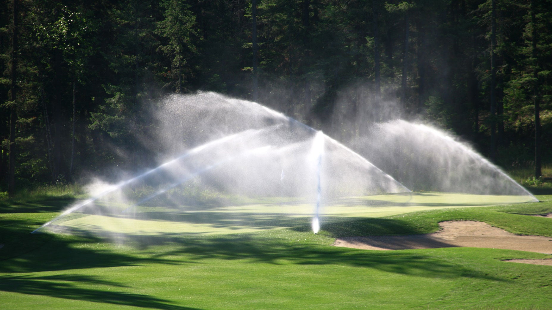 A golf course being irrigated