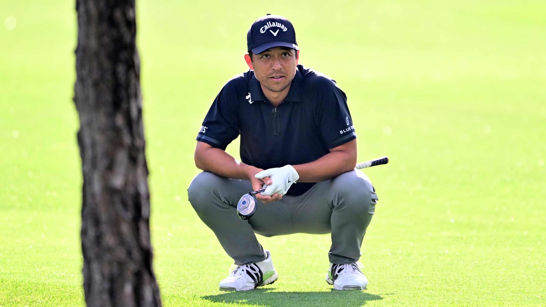 PGA Tour pro Xander Schauffele lines up a putt on the 14th hole during the first round of the 2025 Valspar Championship at Innisbrook Resort.